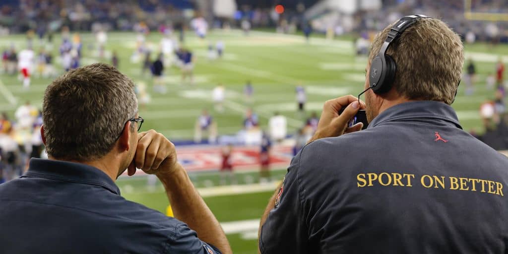 Sports bettor focused, avoiding errors on a field.